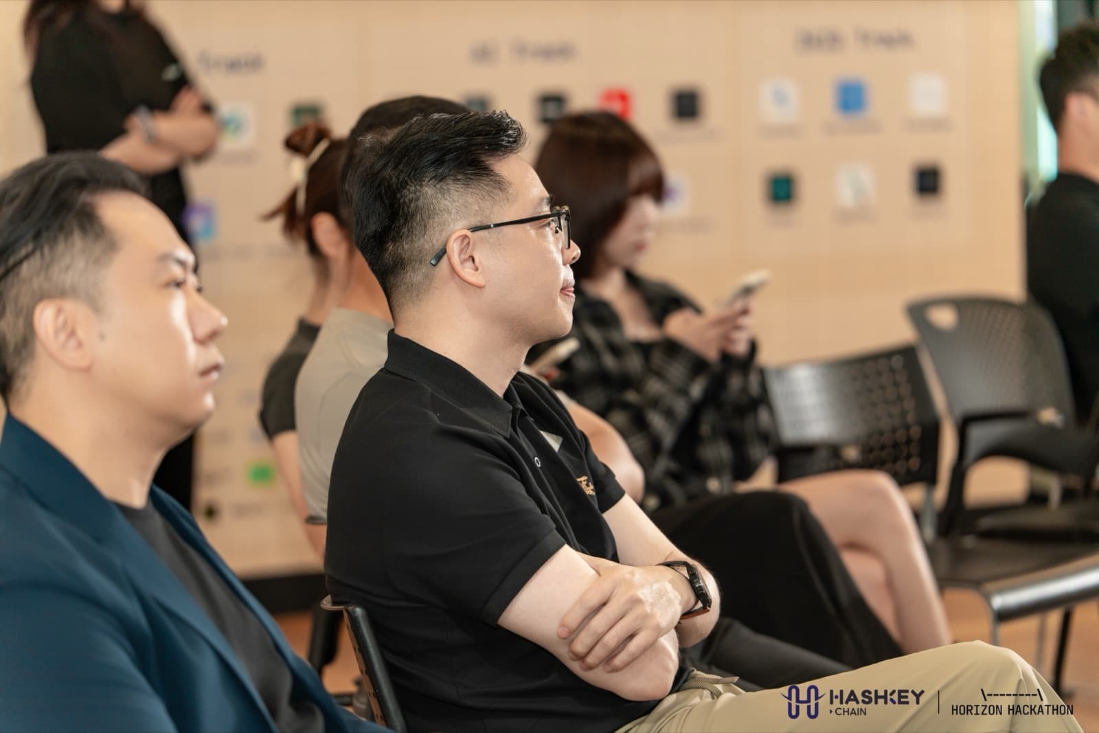 Audience watching demo day presentations